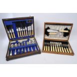 TWO VINTAGE ENGLISH WOODEN CASED CANTEENS OF CUTLERY