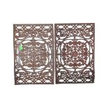 PAIR OF EARLY 20TH CENTURY CAST IRON TABLE TOP TRIVETS
