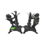 PAIR OF 20TH CENTURY CAST IRON EBONISED CHERUB CANDLE HOLDERS