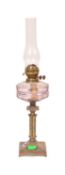 A 19TH CENTURY BRASS AND METAL OIL LAMP