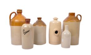 COLLECTION OF SIX STONEWARE FLAGONS