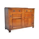 20TH CENTURY JACOBEAN REVIVAL CARVED OAK SIDEBOARD