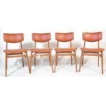 A matching set of four retro mid 20th Century beech framed dining chairs each with faux burgundy