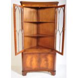 GEORGE III STYLE FLAME MAHOGANY CONCAVE CORNER CABINET