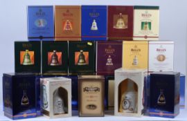 LARGE COLLECTION OF BELLS WHISKY DECANTERS