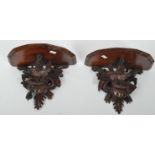 PAIR OF 20TH CENTURY CARVED BLACK FOREST WALL SCONCES