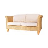 A CONTEMPORARY WICKER CANE TWO SEATER CONSERVATORY SOFA