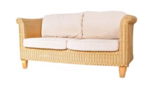A CONTEMPORARY WICKER CANE TWO SEATER CONSERVATORY SOFA