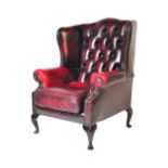 20TH CENTURY OXBLOOD CHESTERFIELD STYLE WINGBACK ARMCHAIR