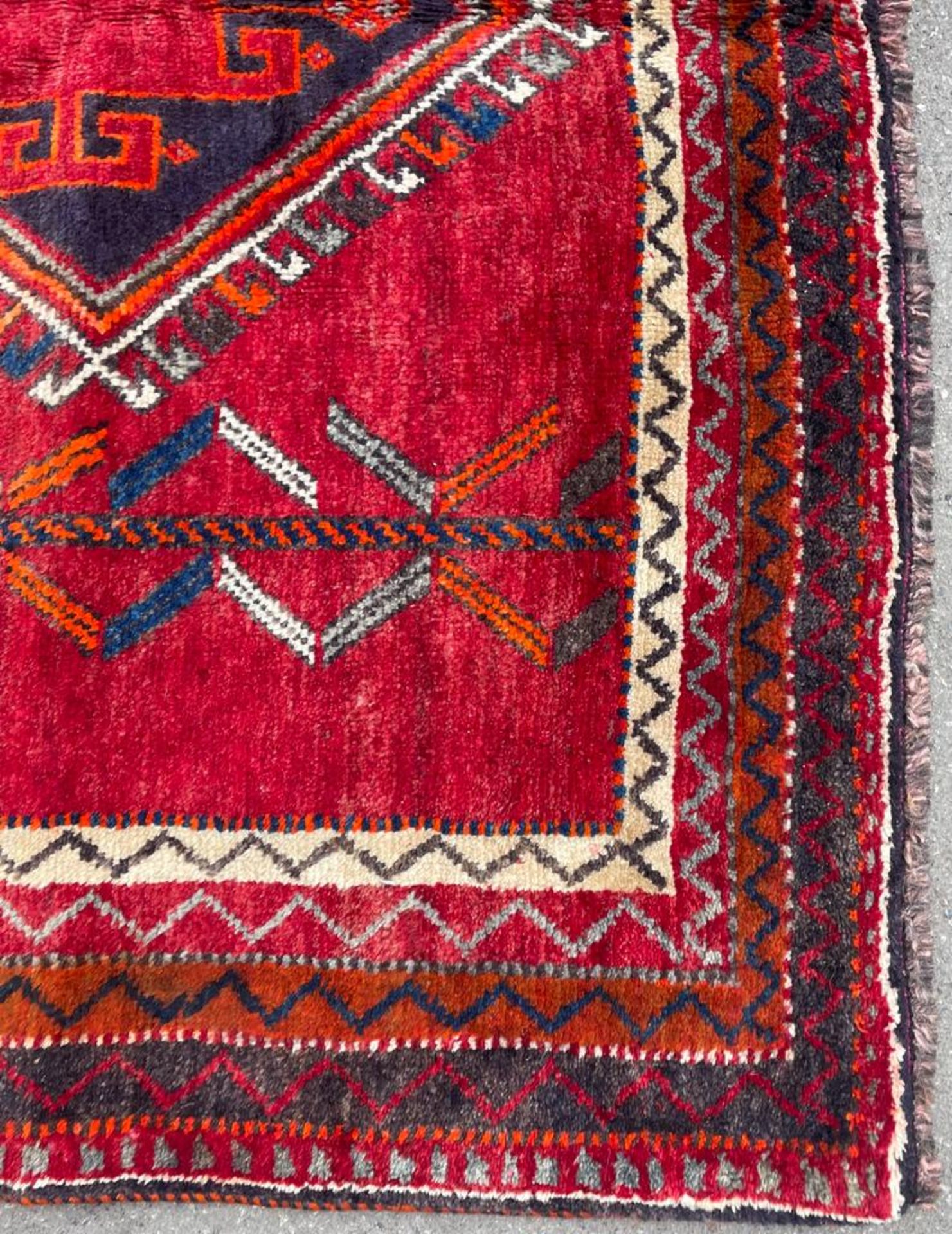 A 20th century South West Persian Islamic Lori floor carpet rug having a central red panel with - Image 3 of 4