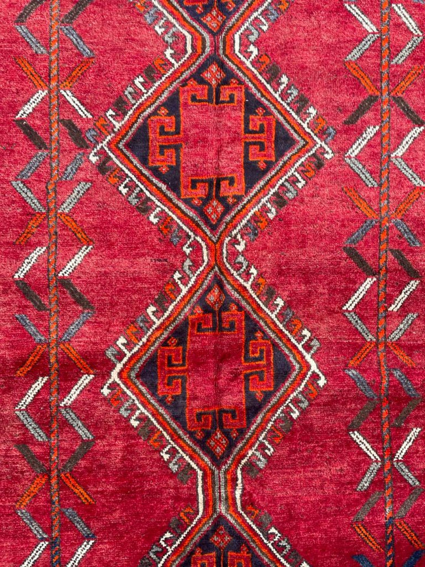 A 20th century South West Persian Islamic Lori floor carpet rug having a central red panel with - Image 2 of 4