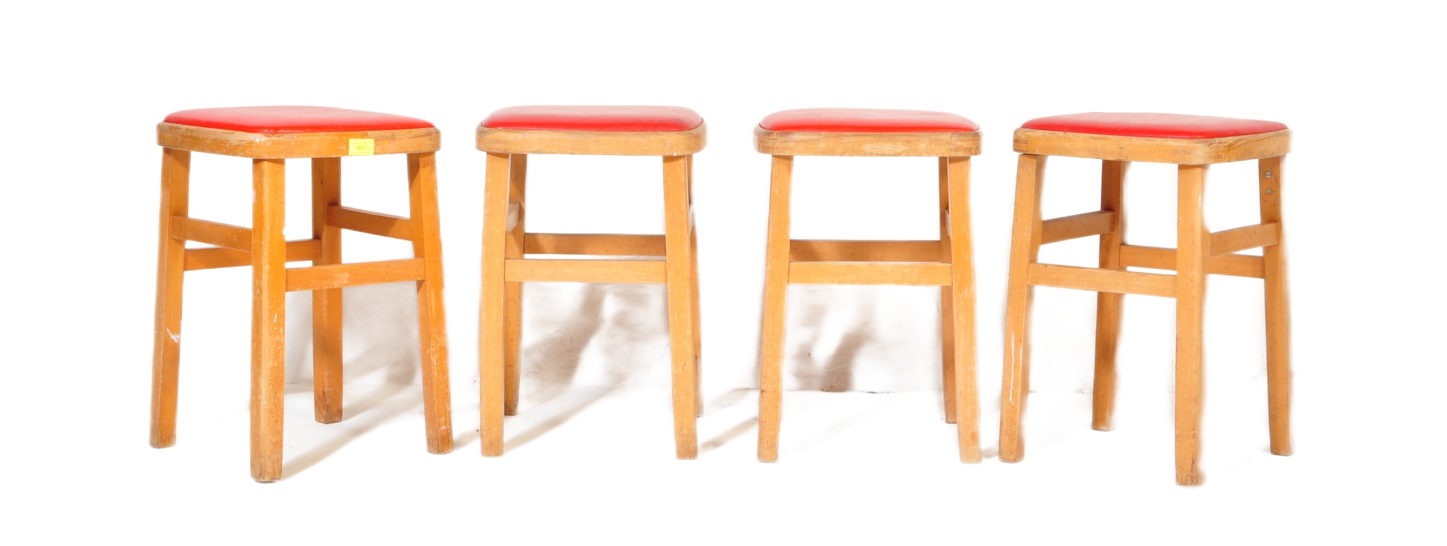 FOUR RETRO MID CENTURY RED LEATHER STOOLS