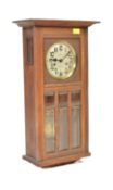 1920S FRENCH OAK CASED 8-DAY WALL CLOCK
