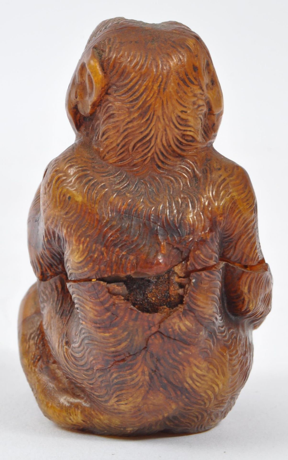 20TH CENTURY COMPOSITE AMBER MONKEY FIGURE - Image 4 of 5