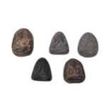 FIVE EARLY 20TH CENTURY THAI HAND CARVED AMULETS