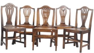 SIX GEORGE III OAK CARVED HEPPLEWHITE DINING CHAIRS