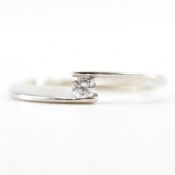 18CT WHITE GOLD & DIAMOND SOLITAIRE CROSSOVER RING
