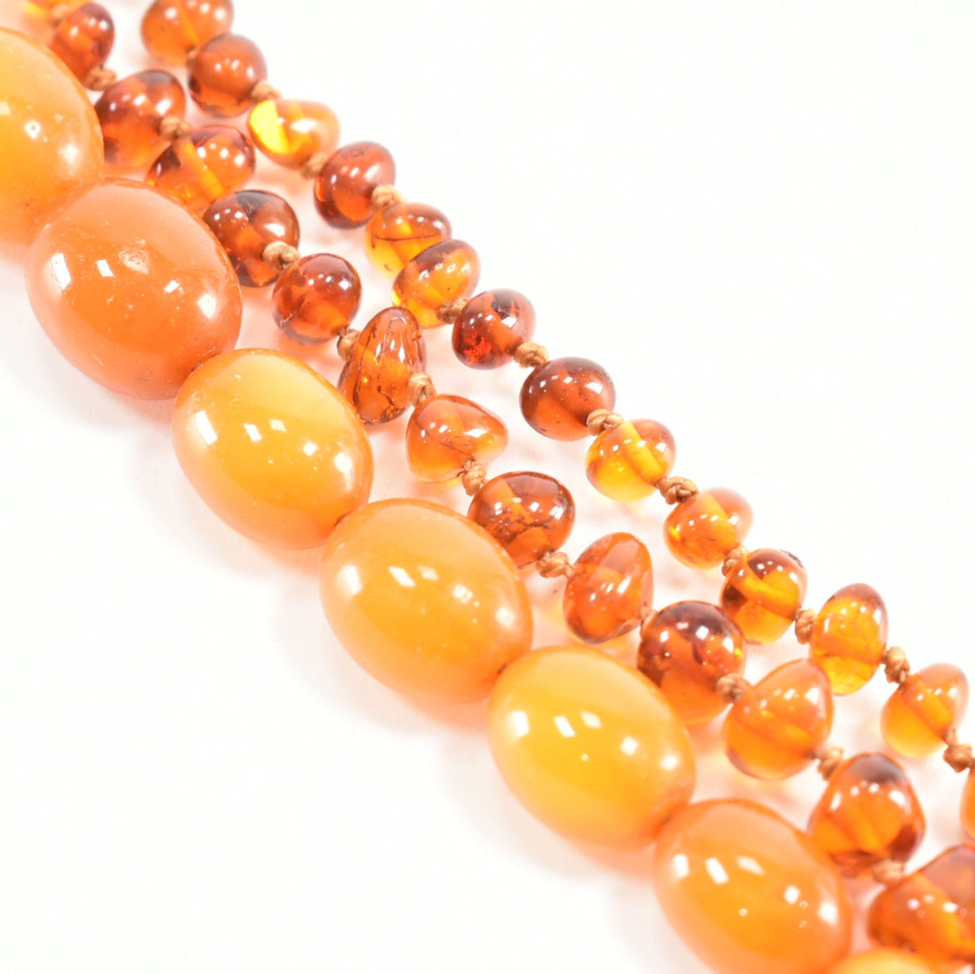 TWO VINTAGE AMBER BEADED NECKLACES