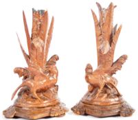 PAIR OF 19TH CENTURY CARVED BLACK FOREST CANDLESTICKS
