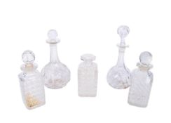 COLLECTION OF FIVE CUT 20th CENTURY GLASS DECANTERS