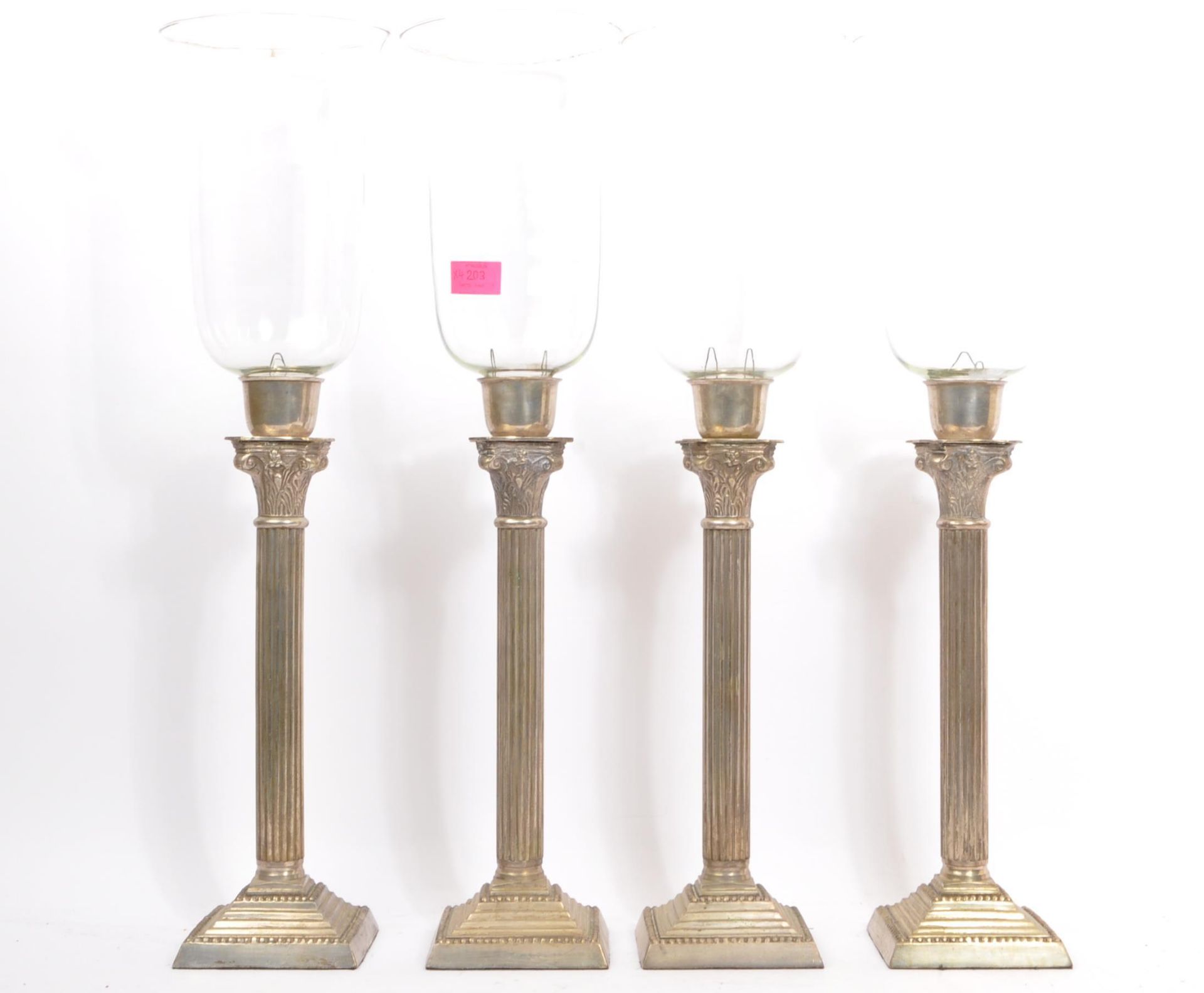 FOUR VICTORIAN COLUMN STORM LAMPS