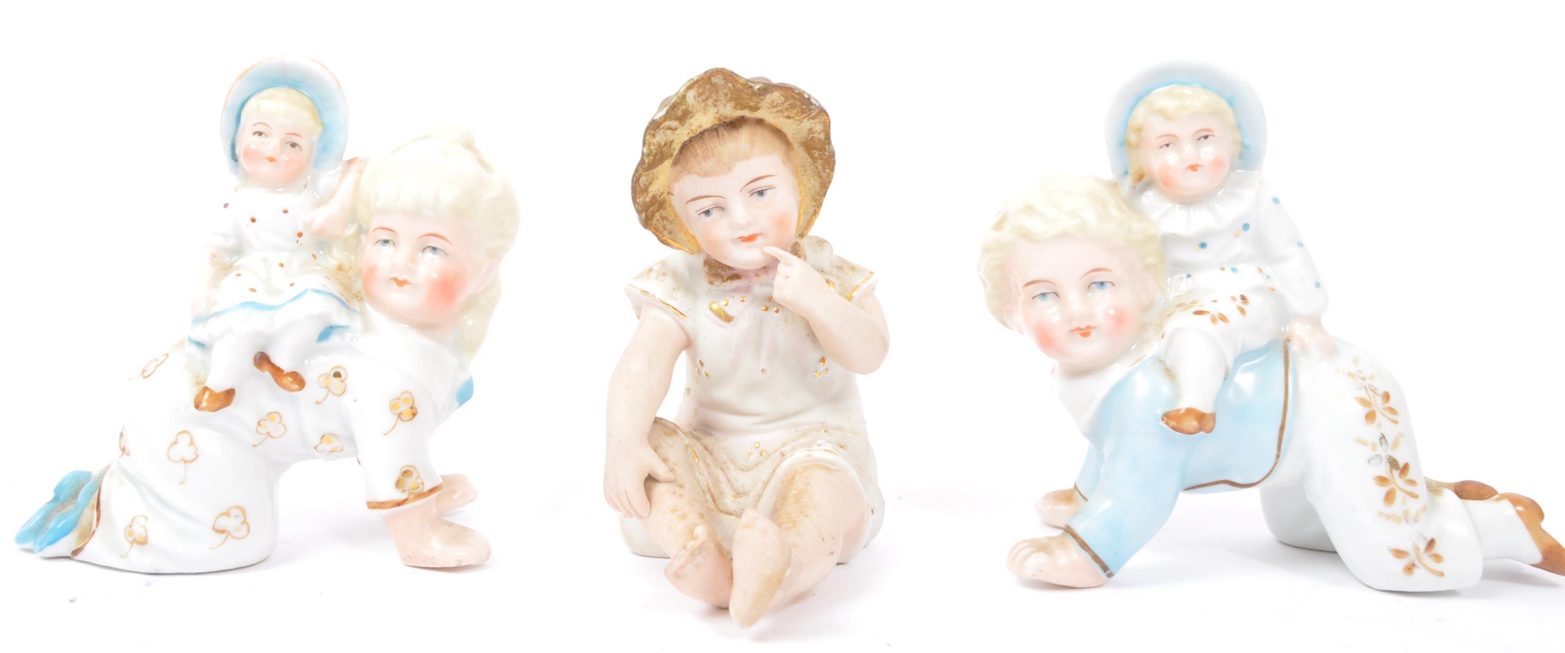 THREE EARLY 20TH CENTURY GERMAN HUEBACH BISQUE CHINA FIGURES