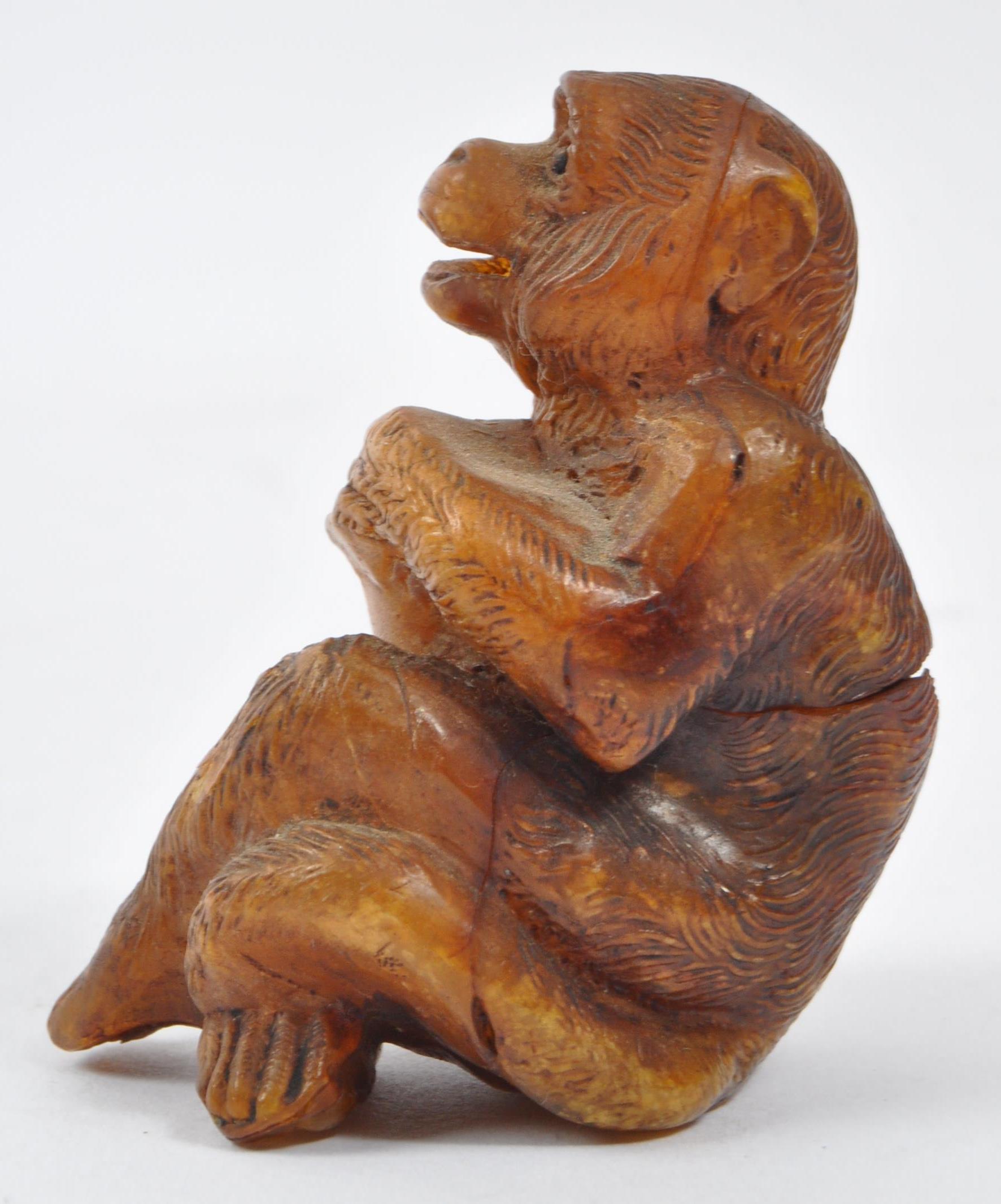 20TH CENTURY COMPOSITE AMBER MONKEY FIGURE - Image 5 of 5