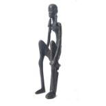 AFRICAN BRONZED FIGURAL STATUE OF A SEATED WOMAN