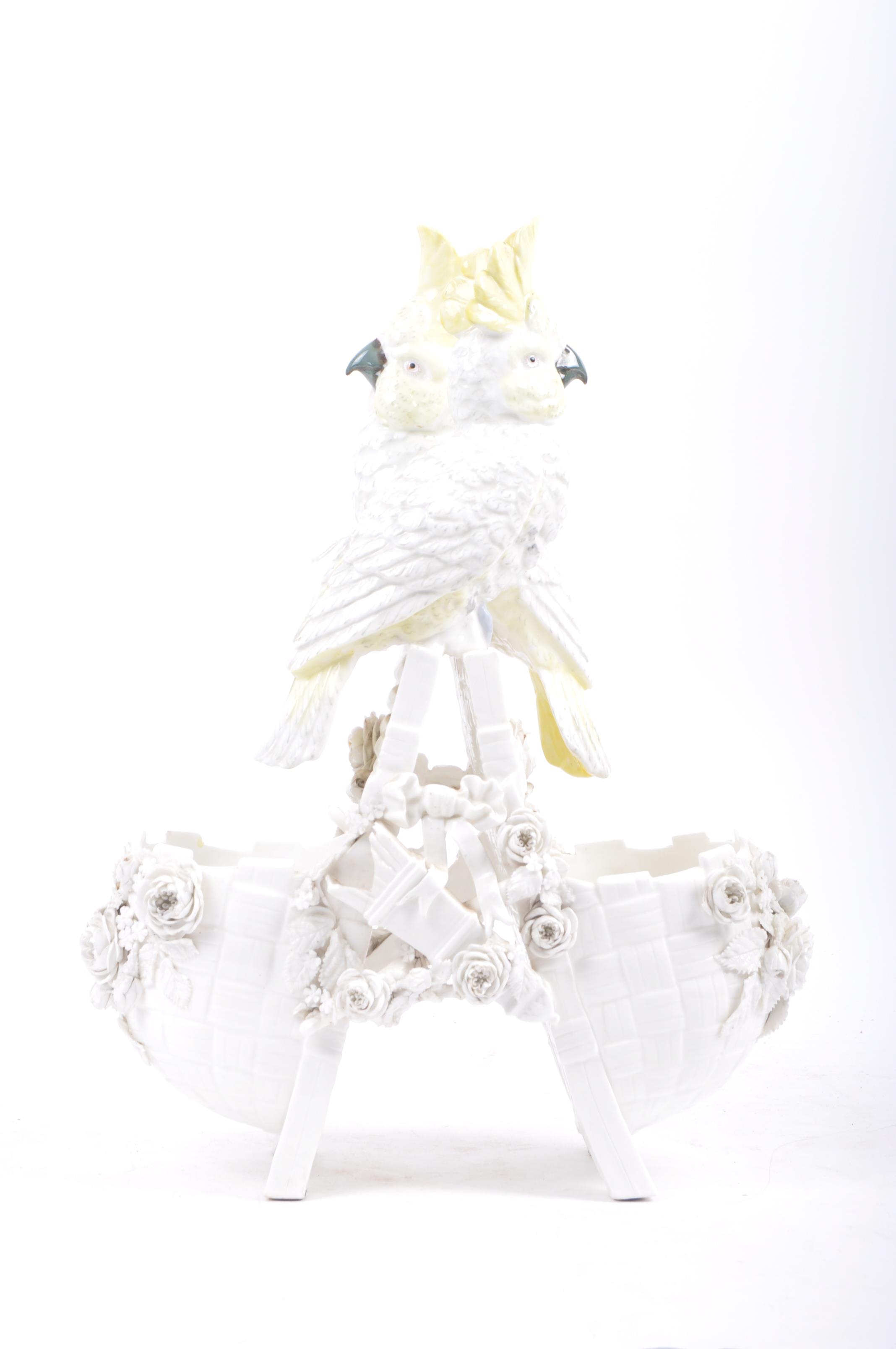 19TH CENTURY COCKATOO ON BASKET FIGURINE GROUP