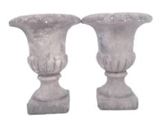 TWO MID CENTURY CLASSICAL STYLE PLASTER GARDEN PLANTERS