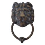 ANTIQUE BRASS DOOR KNOCKER IN THE FORM OF A LION'S HEAD