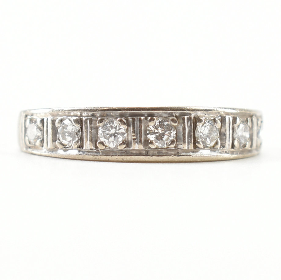 18CT WHITE GOLD & DIAMOND SEVEN STONE RING