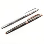TWO RUCKSTUHL STAINLESS STEEL BALL POINT LIDDED PENS IN GIFT BOXES