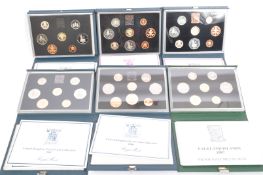 COLLECTION OF EIGHT UNITED KINGDOM PROOF COIN SETS - 1980S