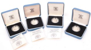 FOUR VINTAGE 1980S ROYAL MINT SILVER PROOF ONE POUND COINS