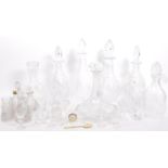 A LARGE COLLECTION OF CUT GLASS DECANTERS AND OTHER ITEMS