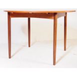 MID 20TH CENTURY TEAK EXTENDING DINING TABLE