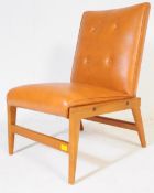 A RETRO VINTAGE MID 20TH CENTURY TAN VINYL CHAIR