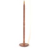 A VINTAGE SOLID WOOD FLOOR STANDING 'PINEAPPLE' LAMP STAND
