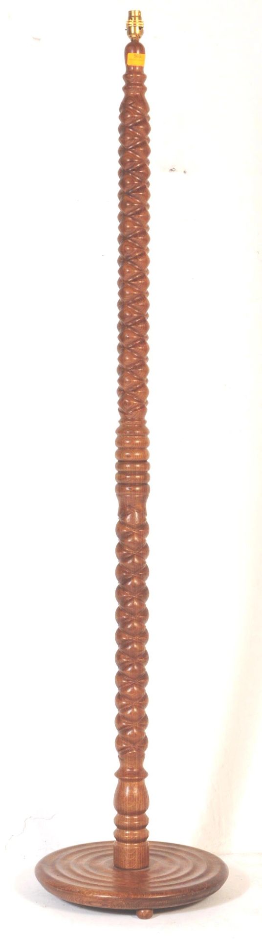 A VINTAGE SOLID WOOD FLOOR STANDING 'PINEAPPLE' LAMP STAND