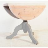 A CONTEMPORARY PAINTED PINE WOOD TRIPOD DINING TABLE