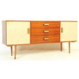 A RETRO VINTAGE 1970 WOODEN SIDEBOARD WITH FORMICA COVERED DOORS