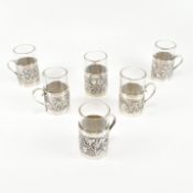 SIX ANGLO INDIAN WHITE METAL HANDLED CUPS
