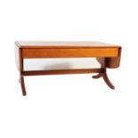 A MID 20TH CENTURY TEAK DROP LEAF COFFEE TABLE