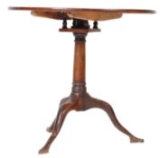 18th century George III mahogany and oak tilt top pedestal loo table. Raised on splayed legs with