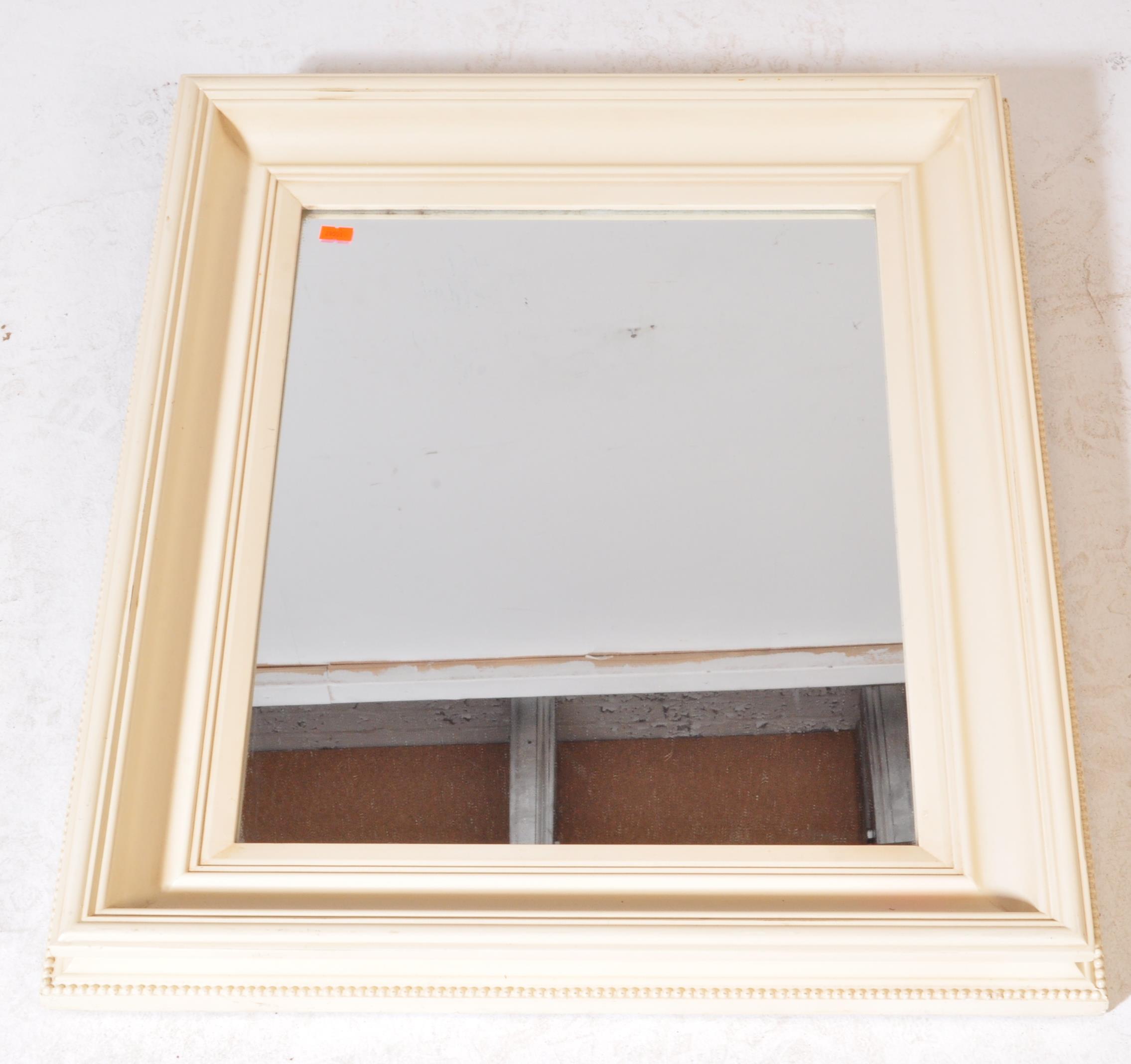 A contemporary cream painted overmantel / wall mirror, The mirror being set within a cushion style - Image 2 of 4