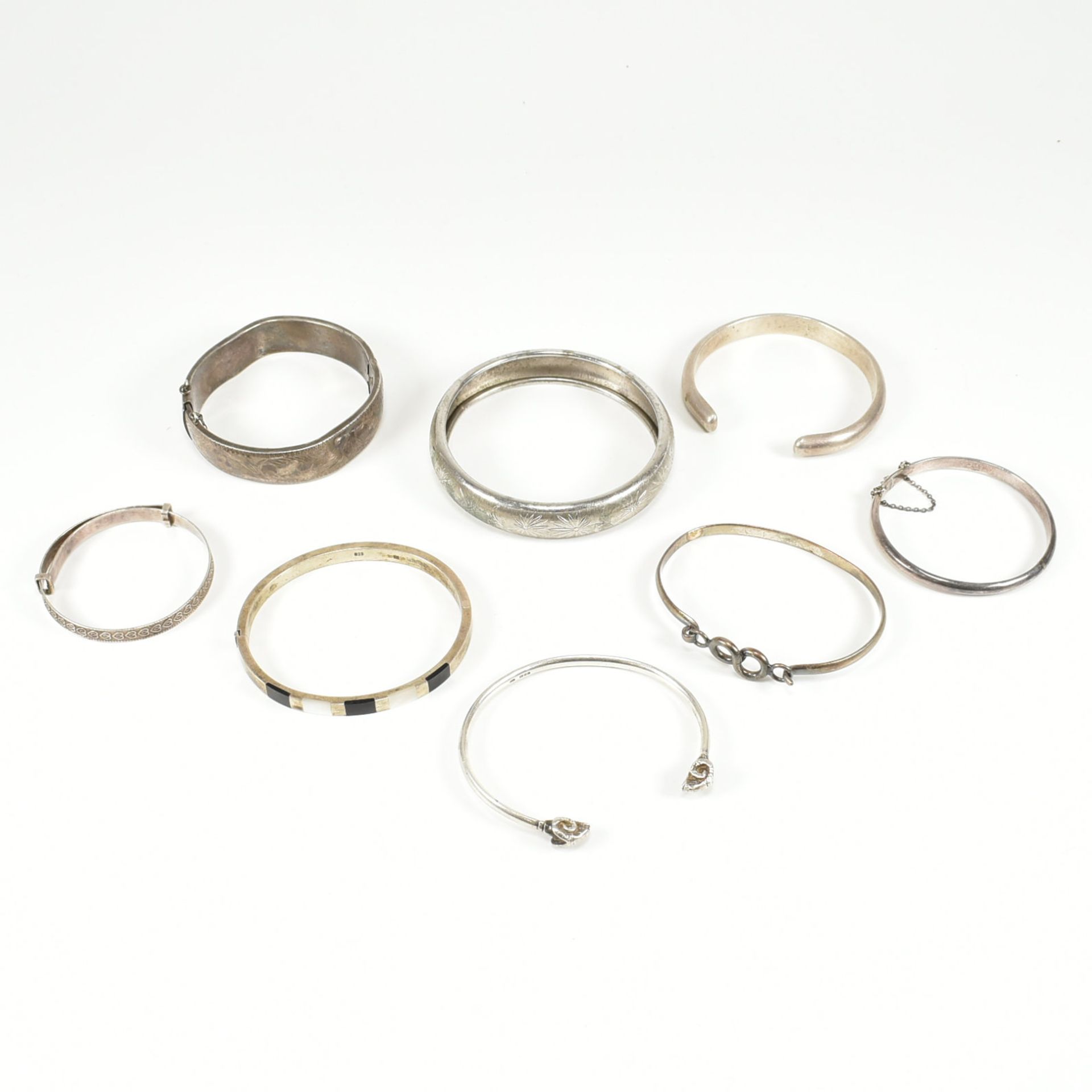 COLLECTION OF ASSORTED SILVER BANGLE BRACELETS