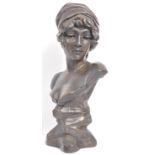 FAUX BRONZE BUST DEPICTING A YOUNG WOMAN