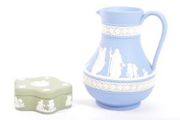 TWO PIECES OF WEDGWOOD JASPERWARE IN JUG AND POT FORM