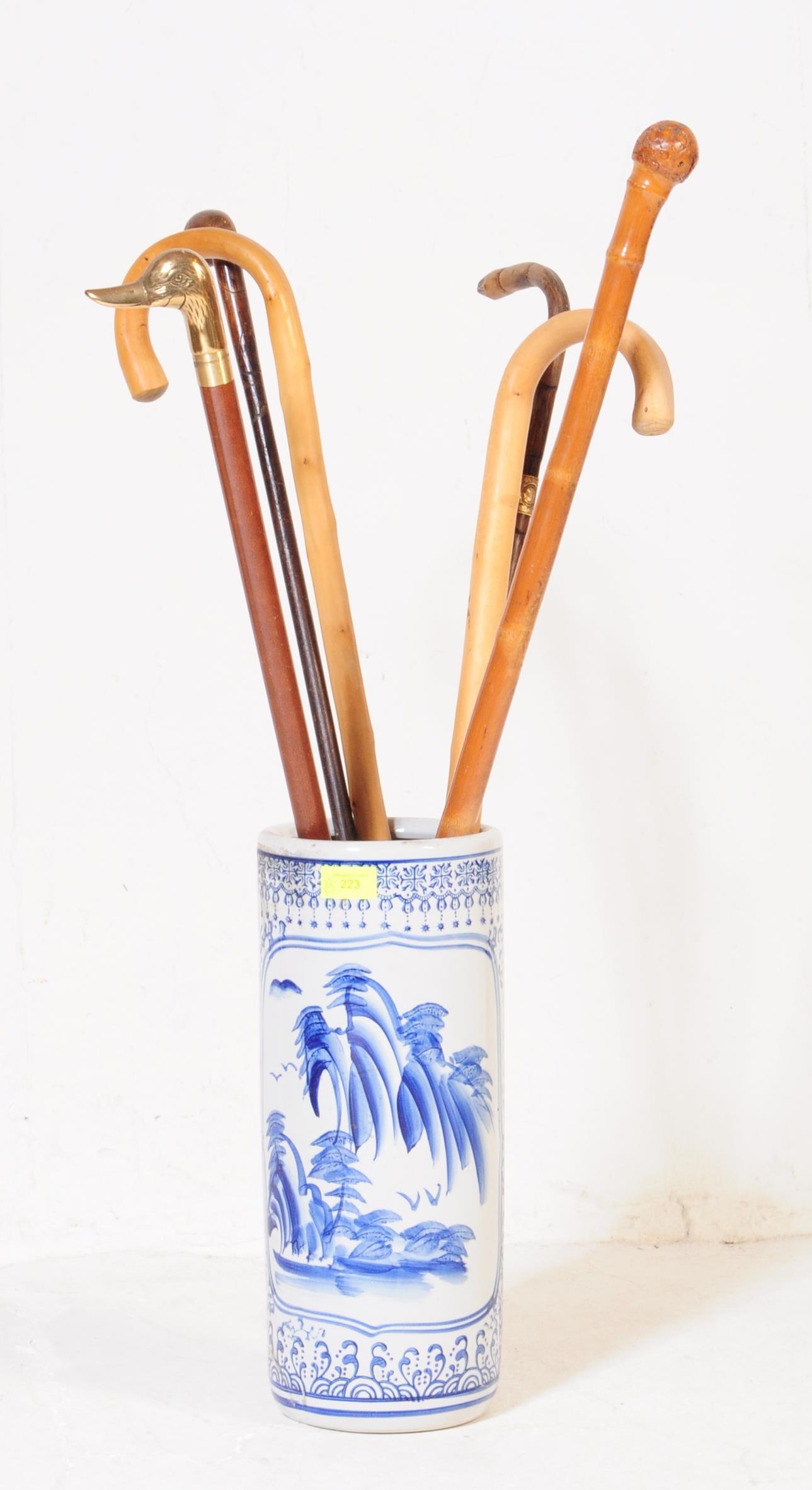 COLLECTION OF VINTAGE CARVED WALKING STICKS WITH STICK STAND